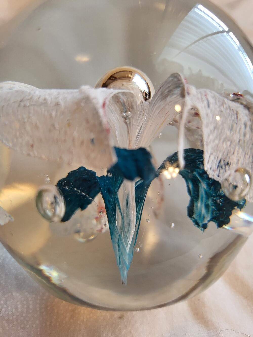 Handblown Glass Art 3 x 3 In. Sphere with White and Teal Floral Core Paperweight - Picture 9 of 10